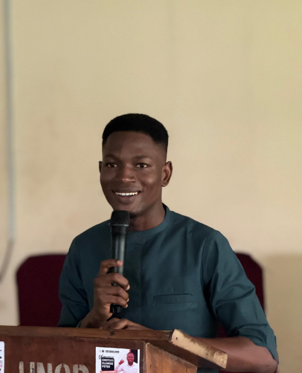 A student speaking at a podium.