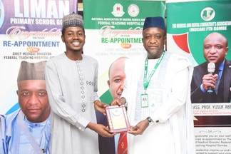 An award presentation on stage.