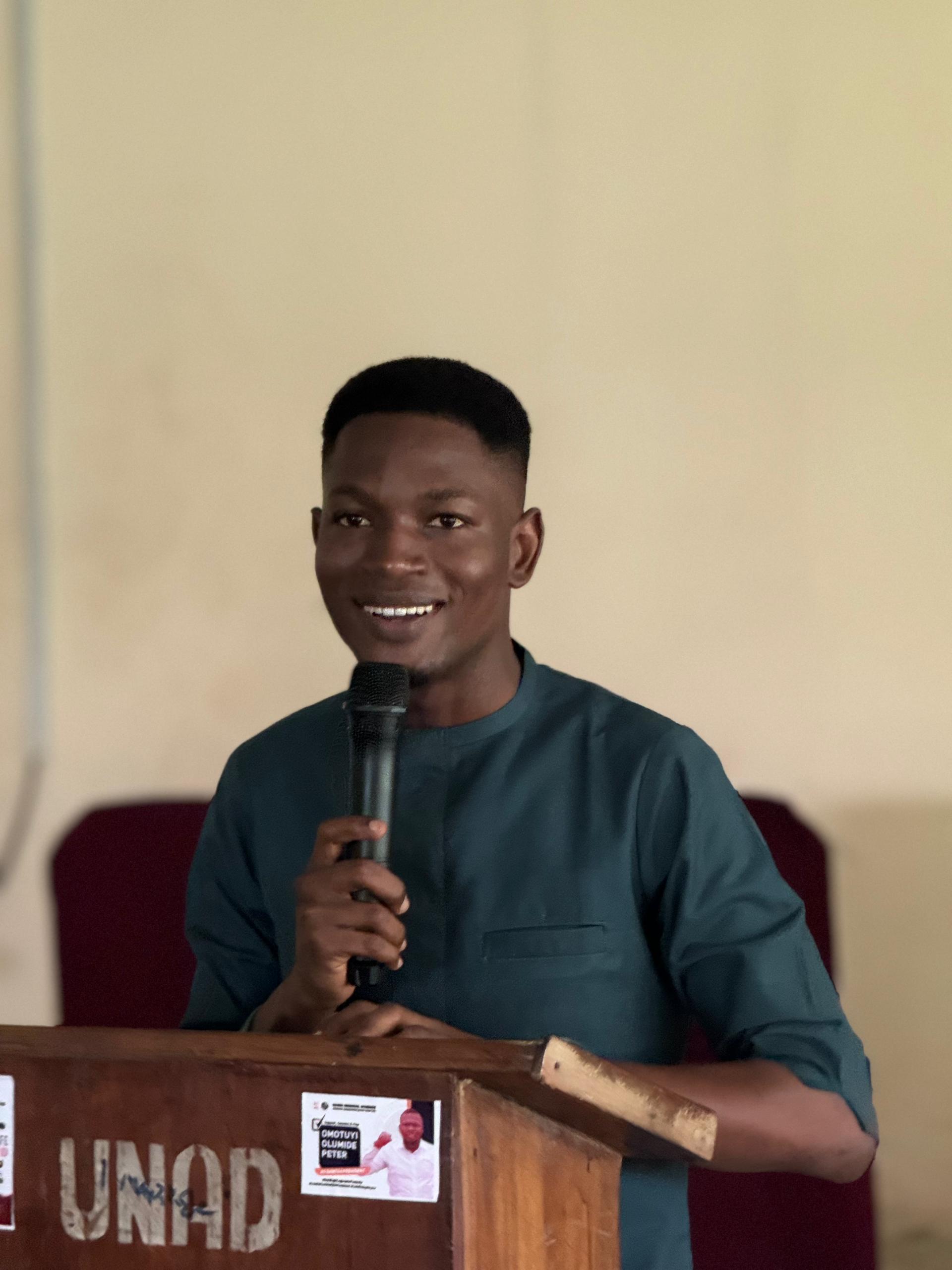 A speaker presenting at a podium.
